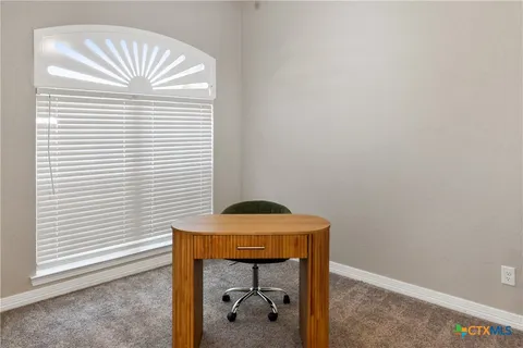 a dining room with a window