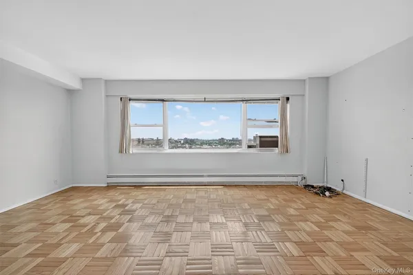 a bedroom with a bed and a potted plant