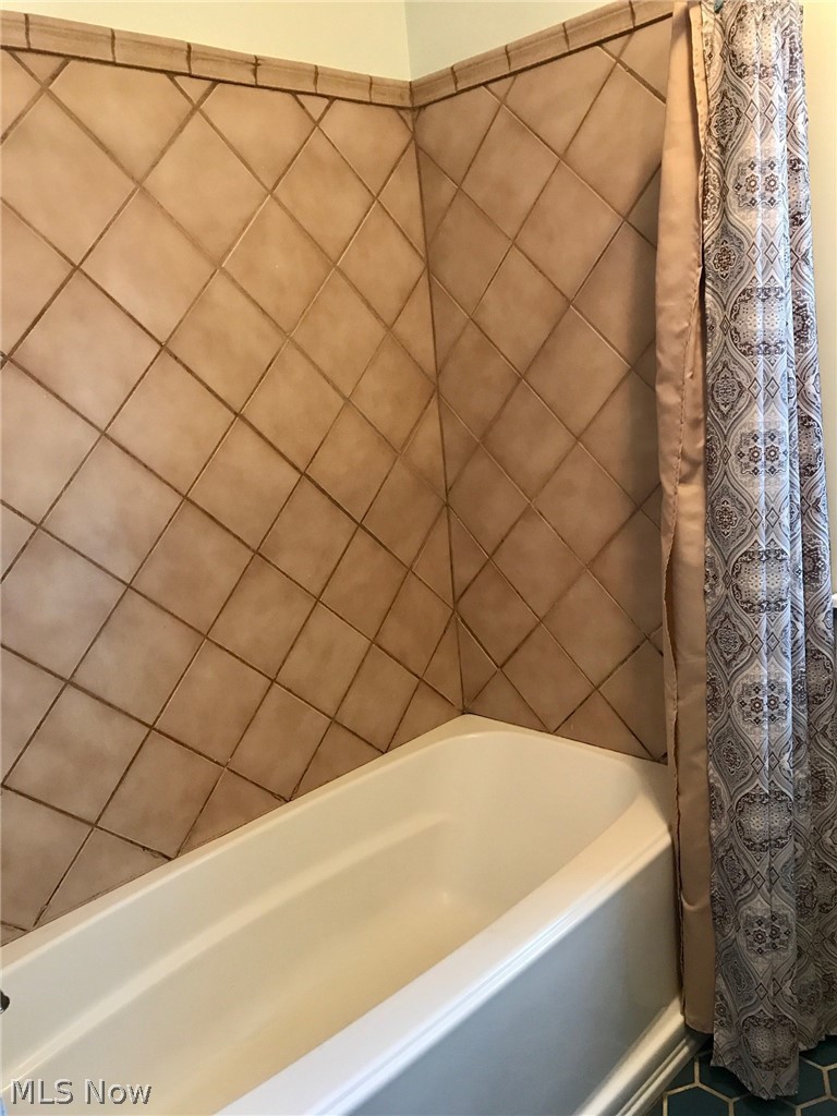 1884 Meadows Road Madison, OH 44057 - Photo 19 of 27 Newly tiled tub