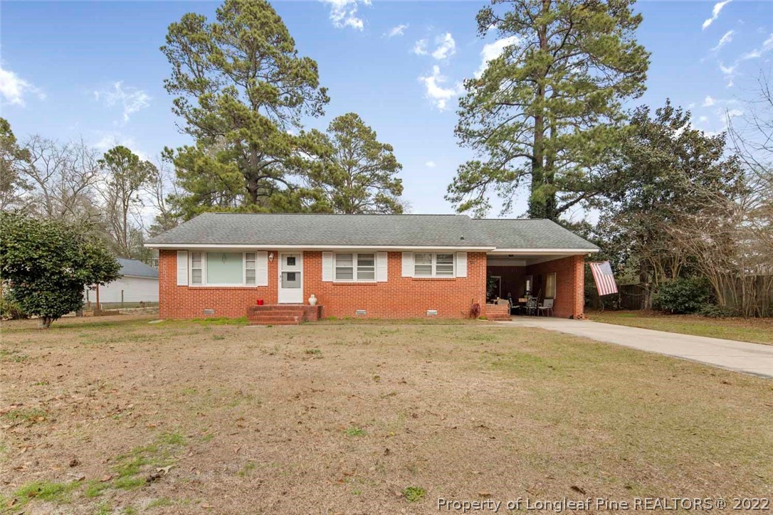 418 Pine Lake Park Road Pembroke, NC 28372 - Photo 1 of 19 front view of a house with a yard
