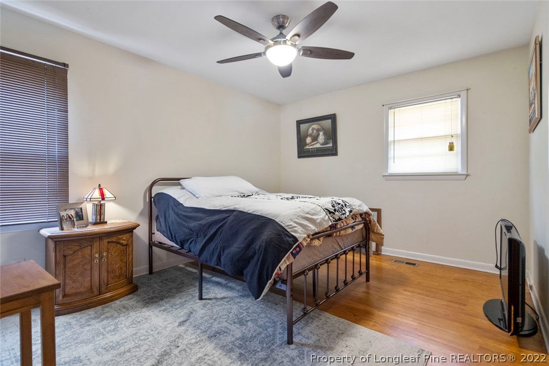418 Pine Lake Park Road Pembroke, NC 28372 - Photo 16 of 19 a bedroom with a bed and a table in it