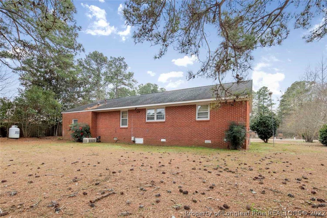 418 Pine Lake Park Road Pembroke, NC 28372 - Photo 18 of 19 a front view of a house with a yard covered with snow