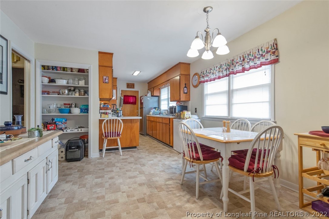 418 Pine Lake Park Road Pembroke, NC 28372 - Photo 6 of 19 a view of a dining room with furniture window and outside view