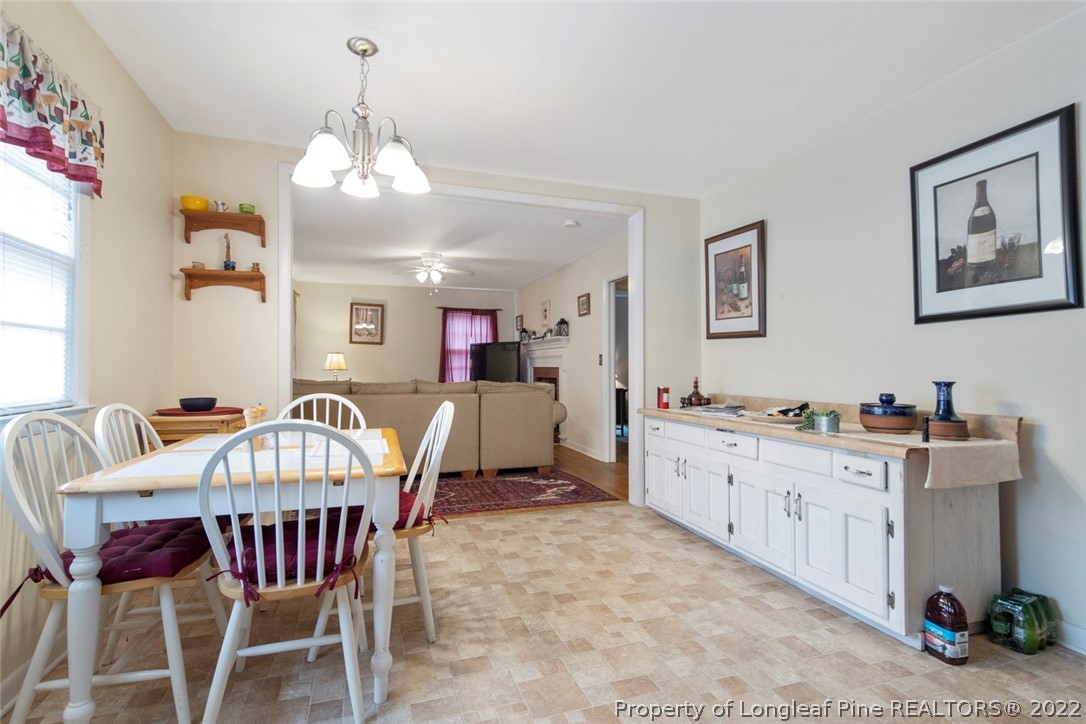 418 Pine Lake Park Road Pembroke, NC 28372 - Photo 7 of 19 a view of a dining room with furniture and chandelier