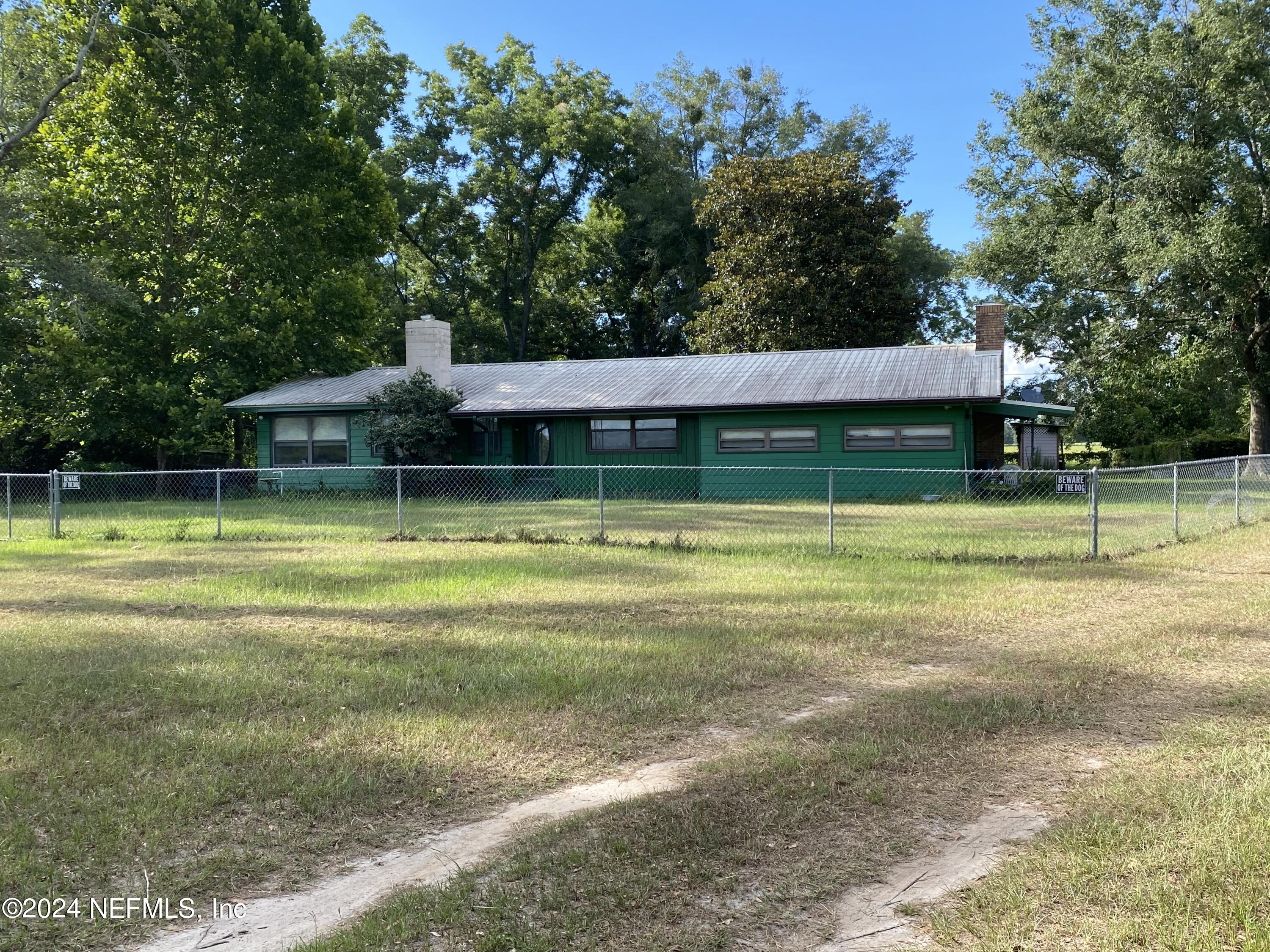 9005 US 90 Lee, FL 32059 - Photo 16 of 19 a view of a house with a backyard