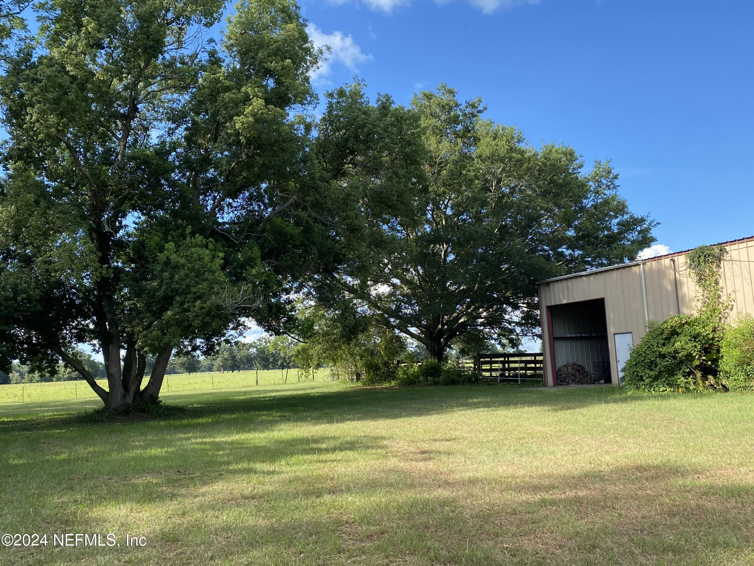 9005 US 90 Lee, FL 32059 - Photo 9 of 19 a front view of a house with a yard