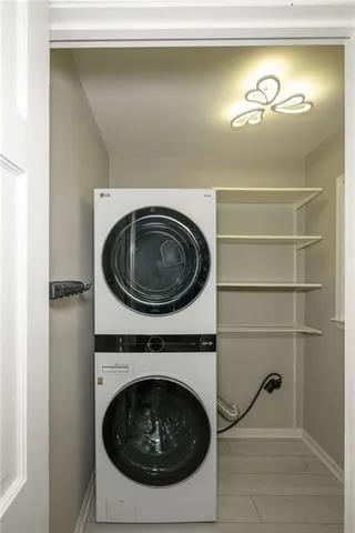 a kitchen with cabinets stainless steel appliances a sink and a window