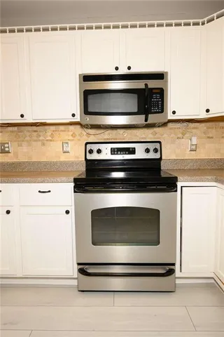 a kitchen with granite countertop a sink and a granite counter tops