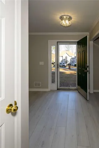 wooden floor in an empty room and a window