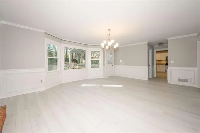 an empty room with a empty space and a window