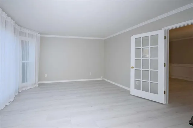 a living room with a fireplace cabinet and a fireplace