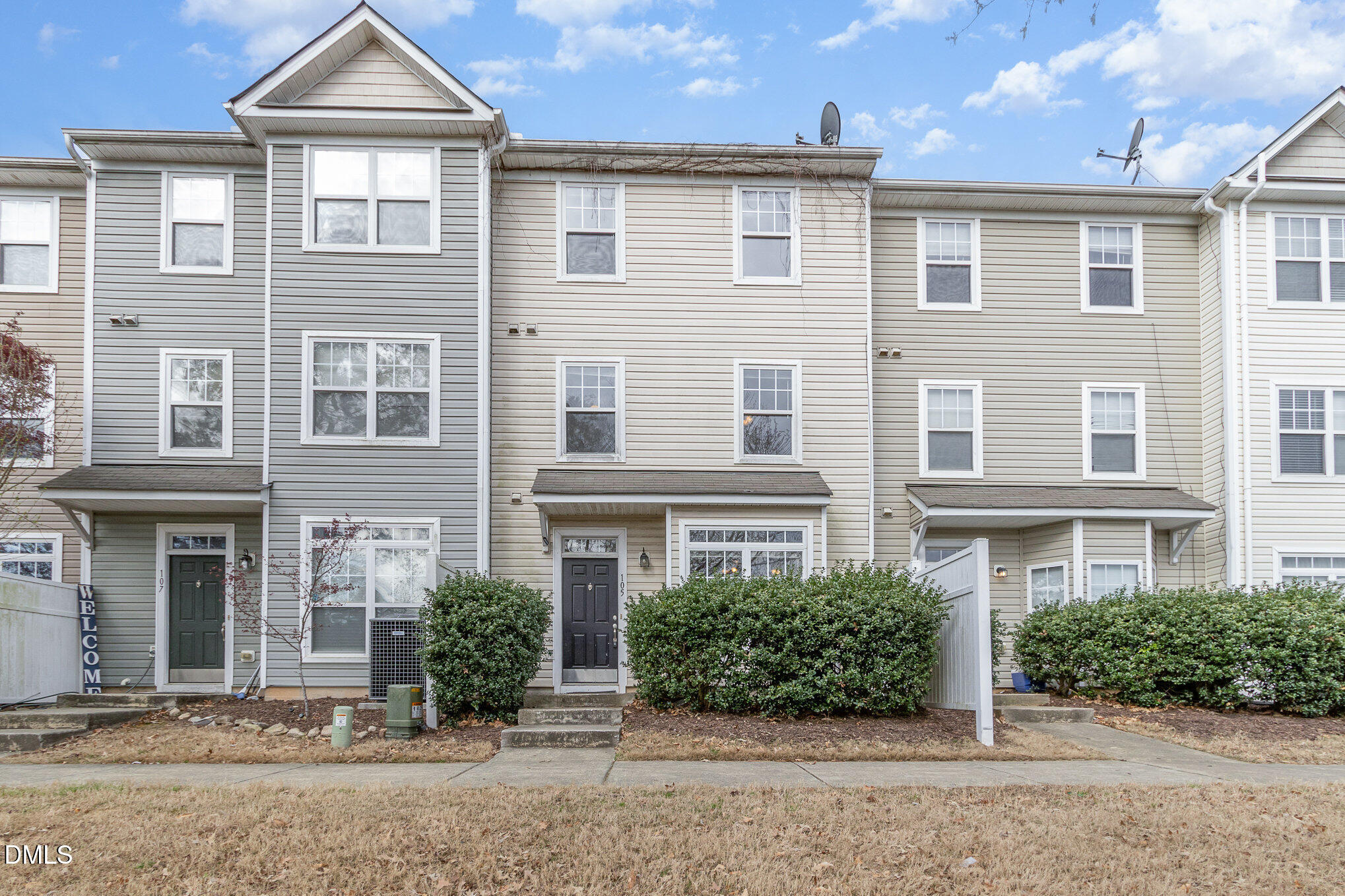 1311 Canyon Rock Court, Unit U105 Raleigh, NC 27610 - Photo 16 of 16 front view of a brick house with a yard