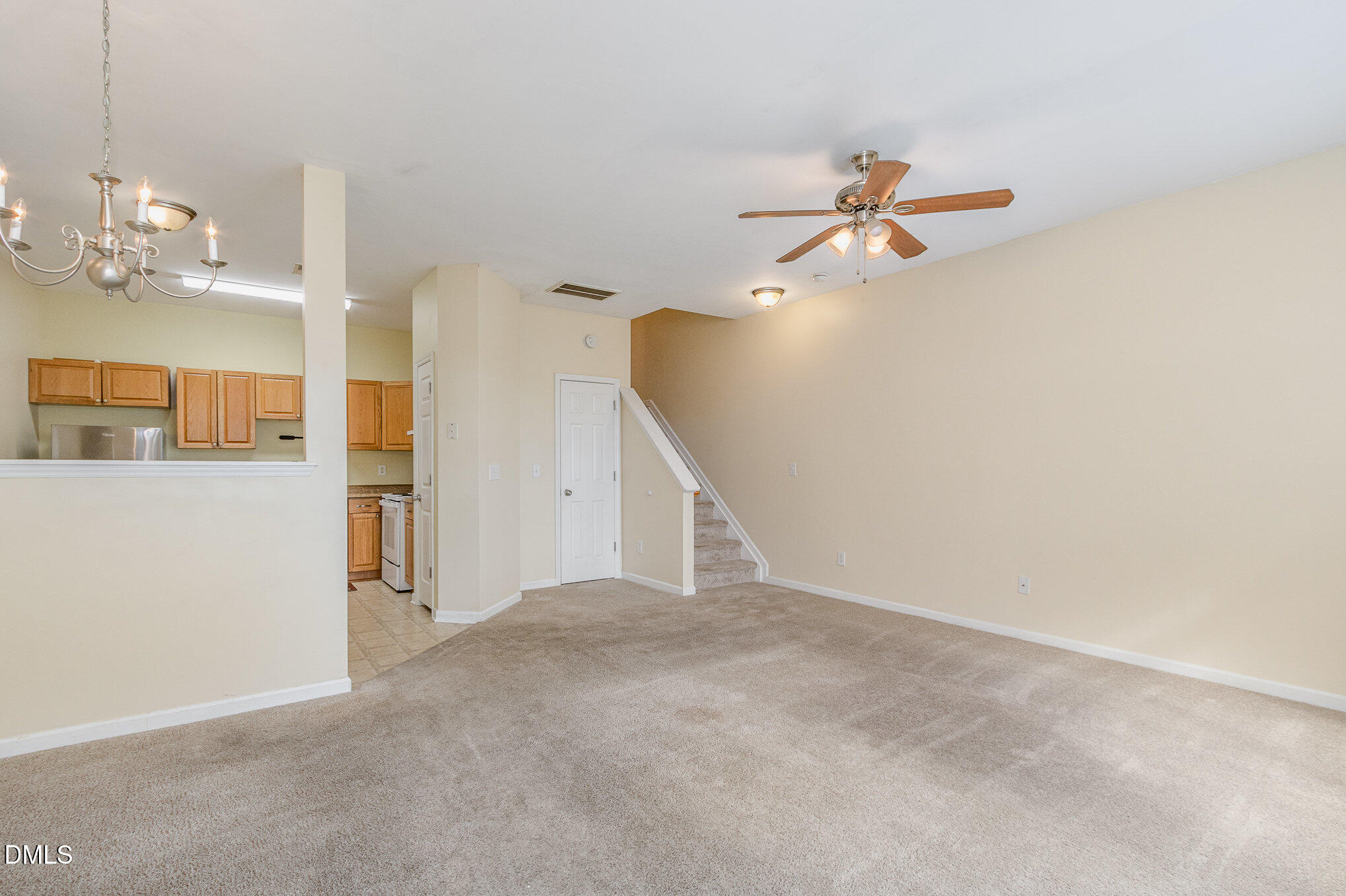 1311 Canyon Rock Court, Unit U105 Raleigh, NC 27610 - Photo 4 of 16 a view of a chandelier fan and fire place