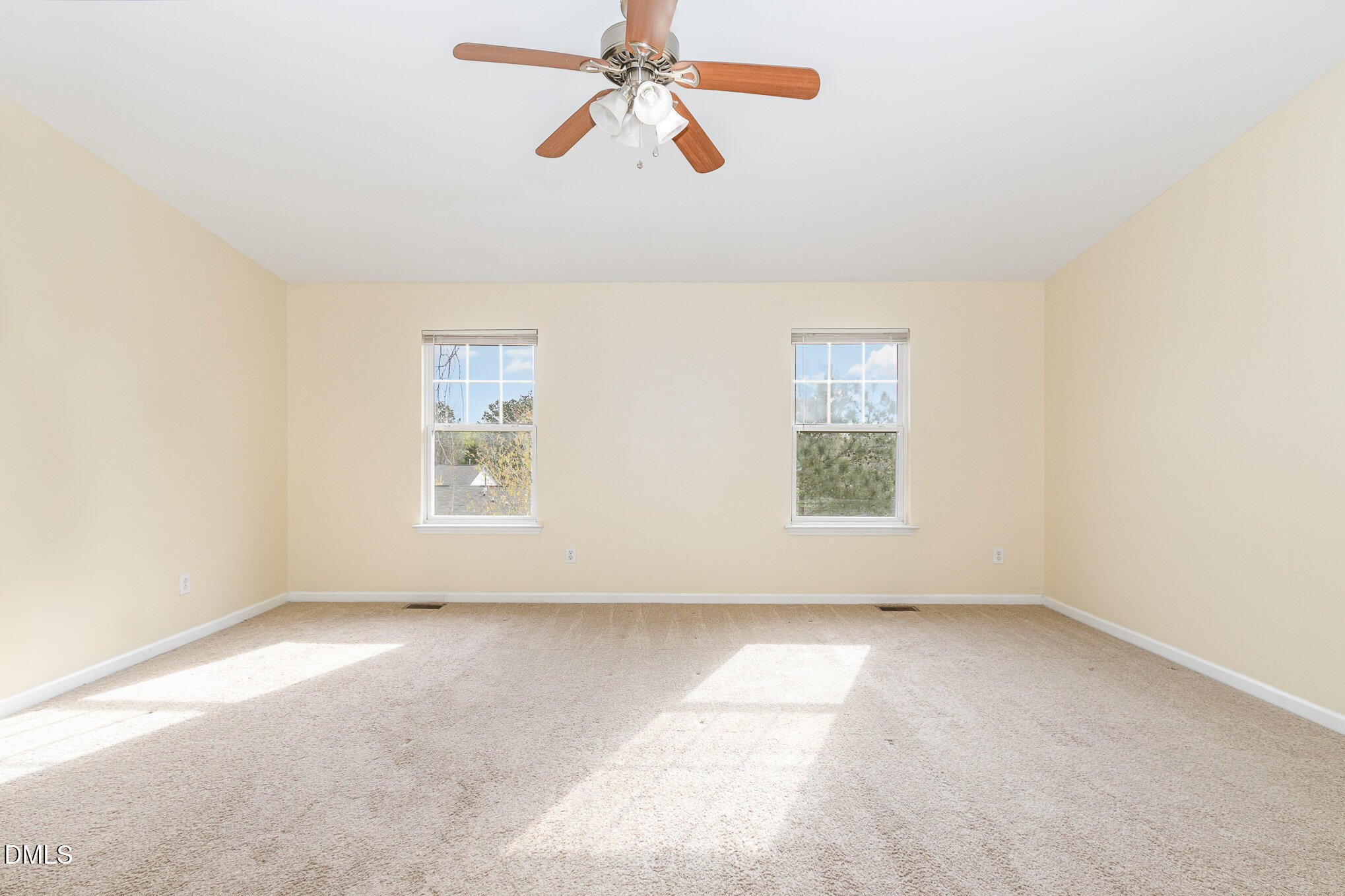 1311 Canyon Rock Court, Unit U105 Raleigh, NC 27610 - Photo 8 of 16 an empty room with windows and fan