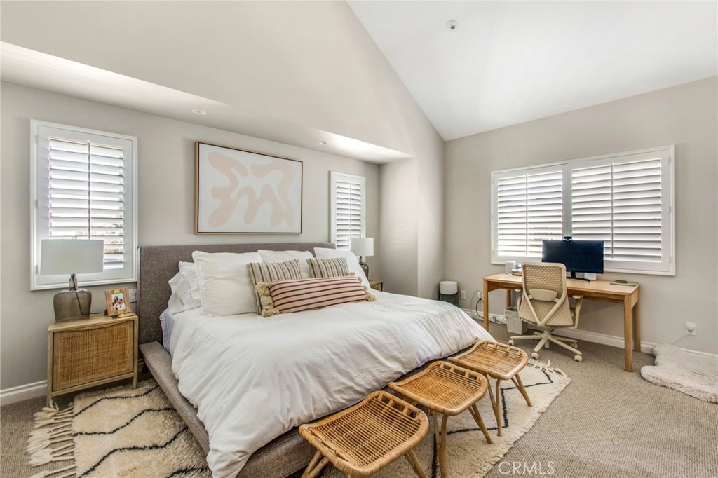 225 16th Place Costa Mesa, CA 92627 - Photo 16 of 43 a bedroom with a bed and wooden floor