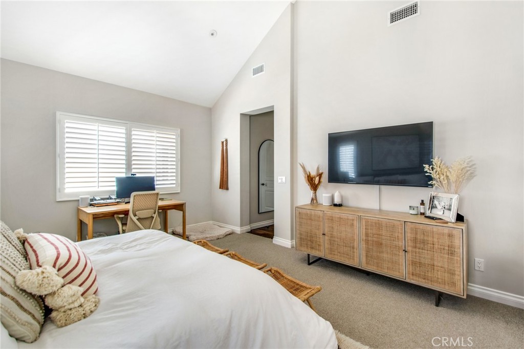 225 16th Place Costa Mesa, CA 92627 - Photo 17 of 43 a bedroom with a bed and a flat screen tv