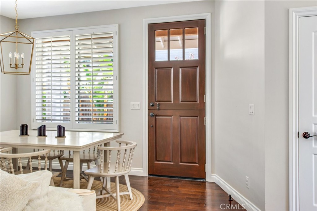 225 16th Place Costa Mesa, CA 92627 - Photo 20 of 43 a dining room with wooden floor and windows