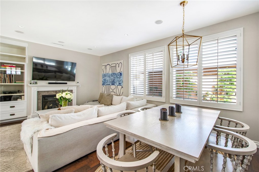 225 16th Place Costa Mesa, CA 92627 - Photo 21 of 43 a living room with furniture a flat screen tv and a large window