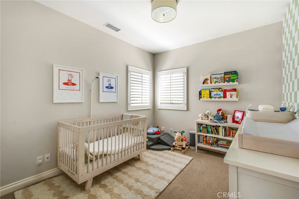 225 16th Place Costa Mesa, CA 92627 - Photo 29 of 43 a bedroom with a bed and a window