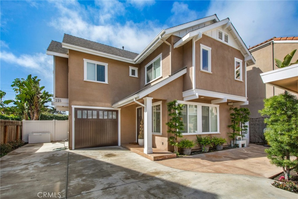 225 16th Place Costa Mesa, CA 92627 - Photo 32 of 43 a view of a white house with large windows and plants