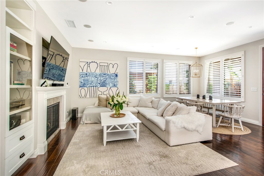 225 16th Place Costa Mesa, CA 92627 - Photo 9 of 43 a living room with furniture and a fireplace