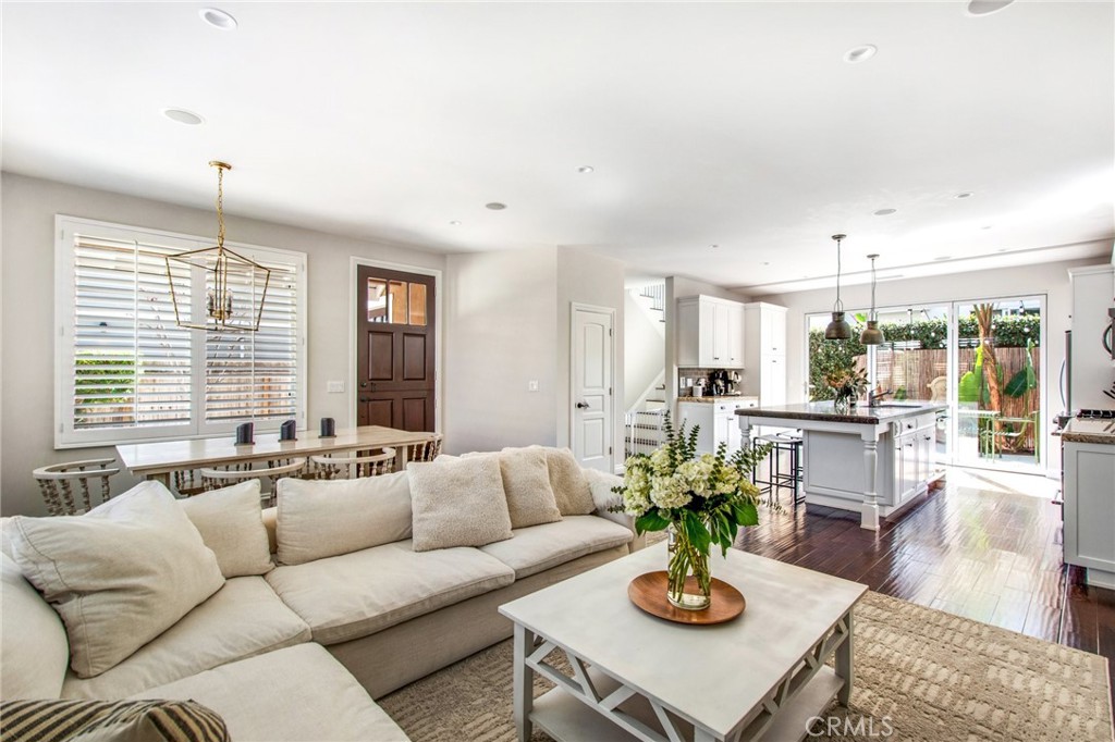 225 16th Place Costa Mesa, CA 92627 - Photo 10 of 43 a living room with fireplace furniture and a large window