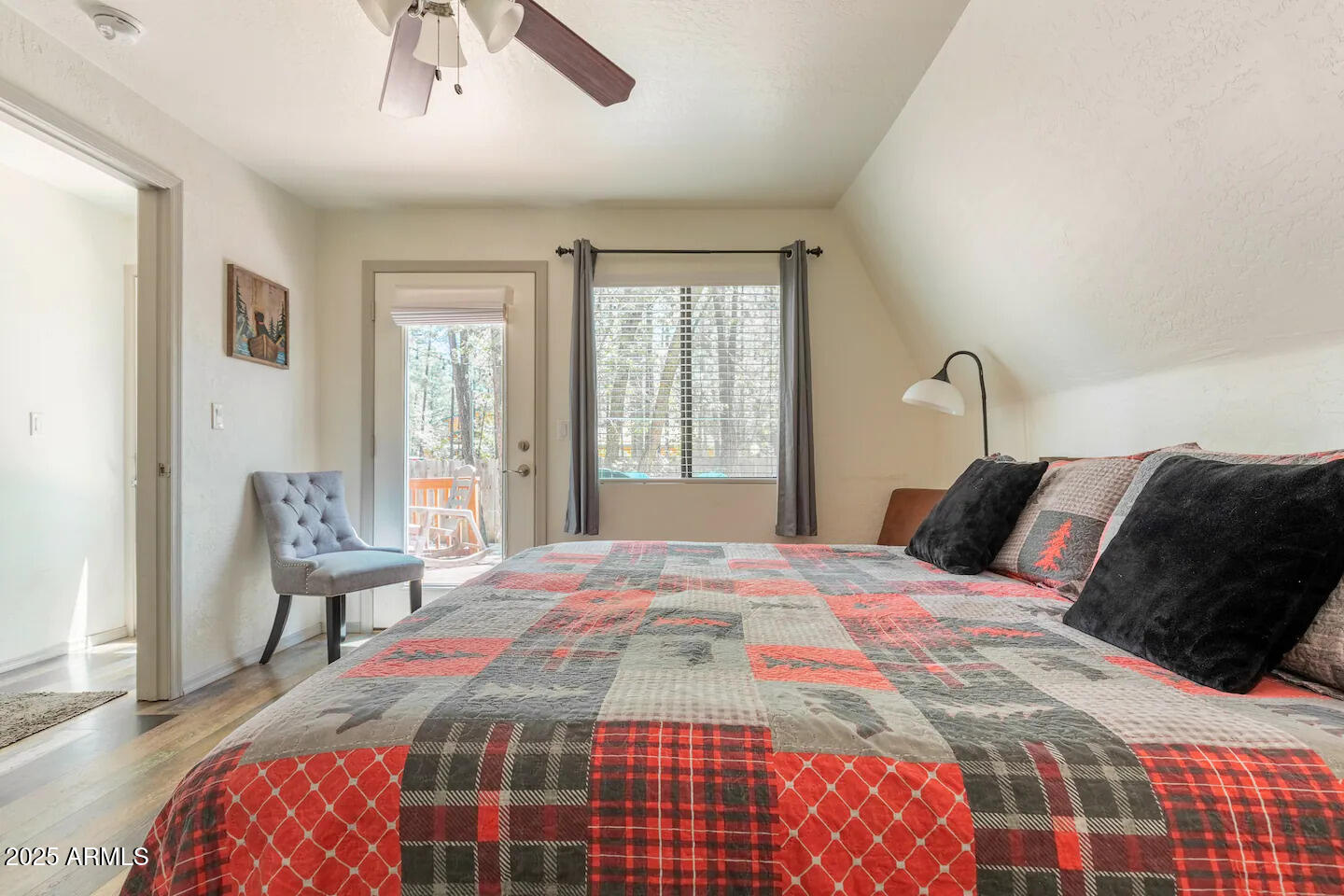 435 Southlake Road Lakeside, AZ 85929 - Photo 16 of 30 a bedroom with a bed and wooden floor