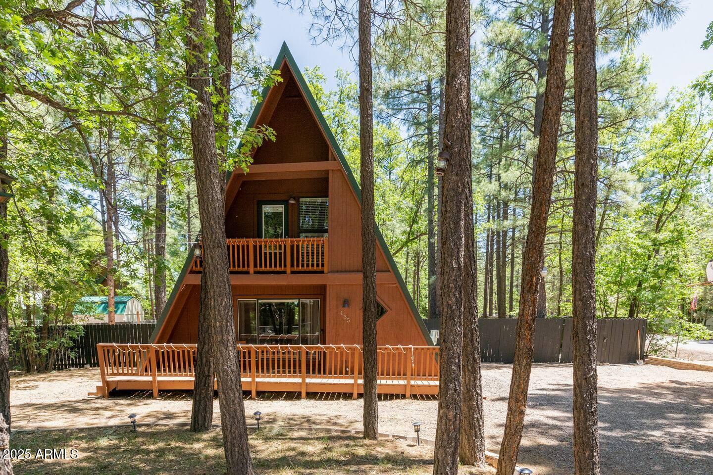 435 Southlake Road Lakeside, AZ 85929 - Photo 2 of 30 a front view of a house with a yard