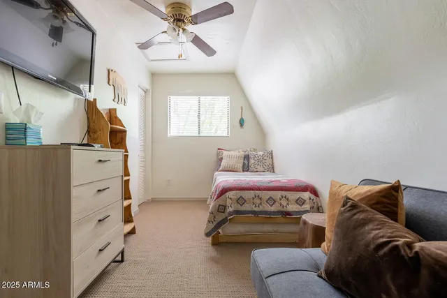 a bedroom with a bed and window