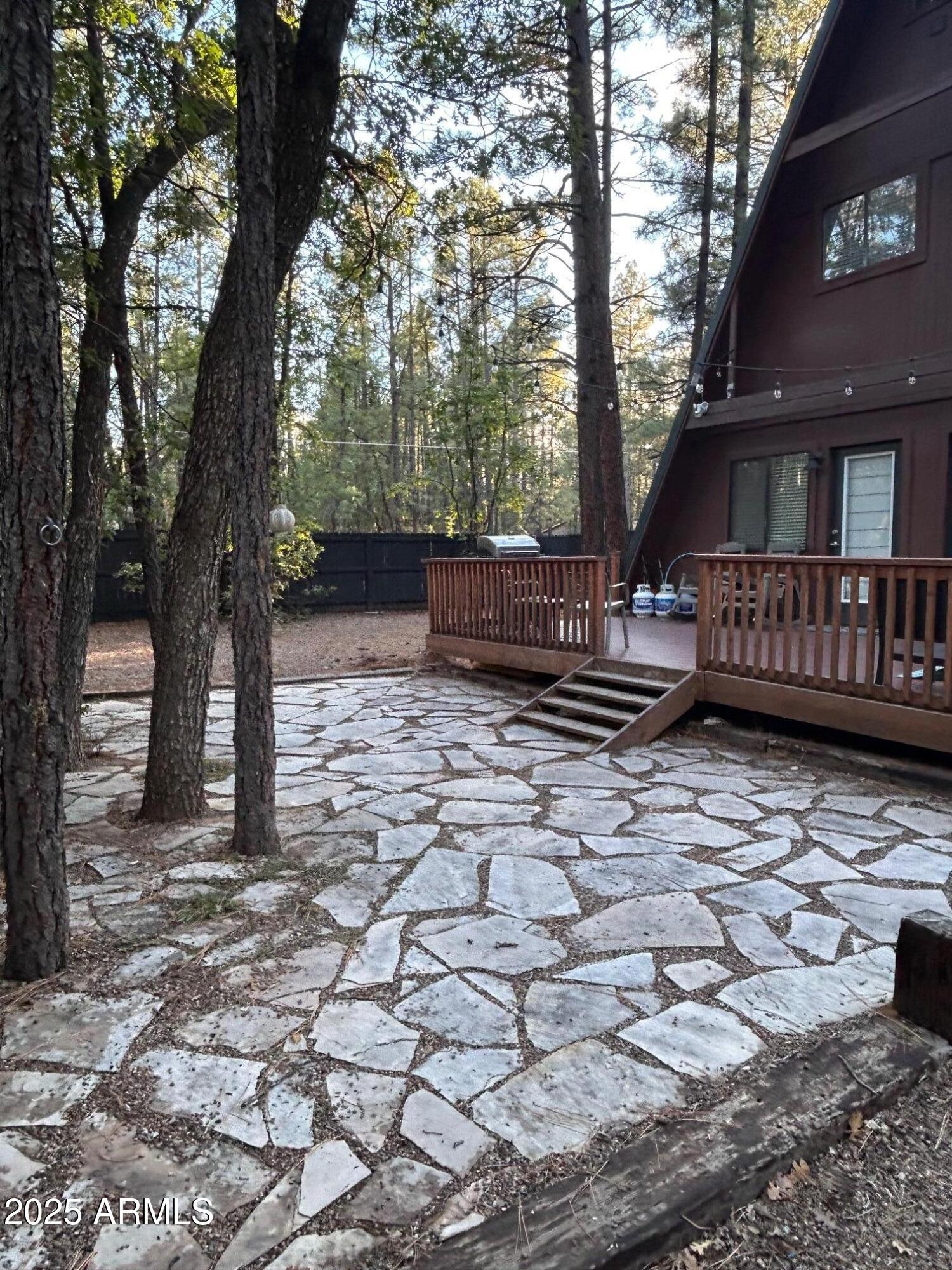 435 Southlake Road Lakeside, AZ 85929 - Photo 27 of 30 a view of a yard with plants and wooden fence