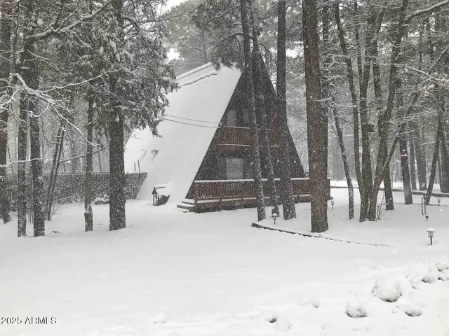 a wooden bench sitting in the middle of a building