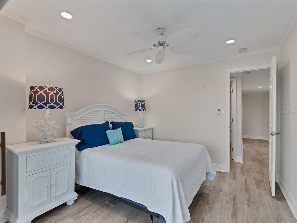 9397 Midnight Pass Road, Unit 501 Sarasota, FL 34242 - Photo 19 of 45 a bedroom with a bed and a table