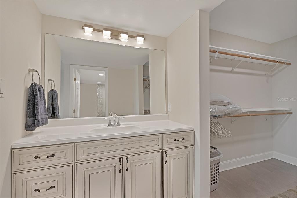 9397 Midnight Pass Road, Unit 501 Sarasota, FL 34242 - Photo 21 of 45 a bathroom with a sink and a mirror