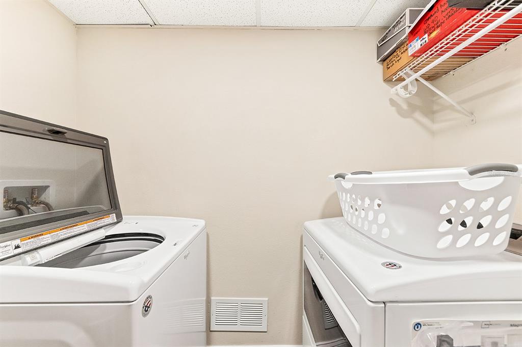 9397 Midnight Pass Road, Unit 501 Sarasota, FL 34242 - Photo 28 of 45 a utility room with dryer and washer
