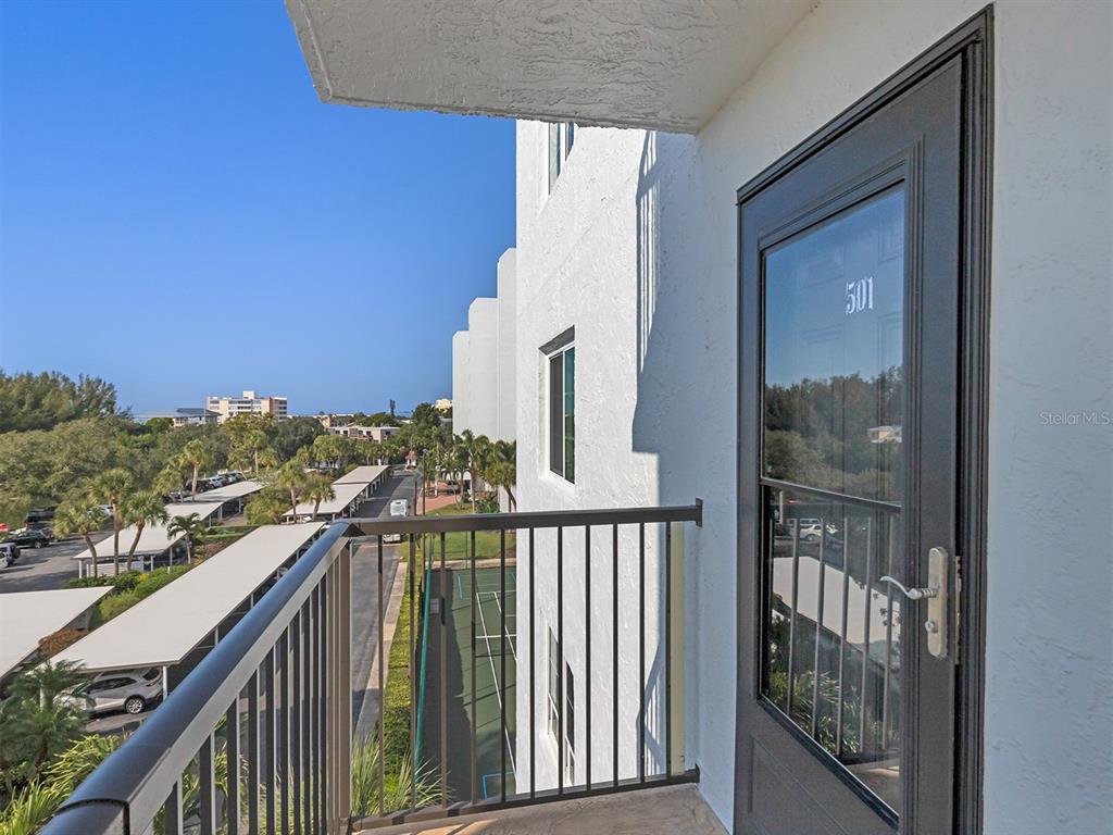 9397 Midnight Pass Road, Unit 501 Sarasota, FL 34242 - Photo 29 of 45 a view of a balcony with an outdoor space