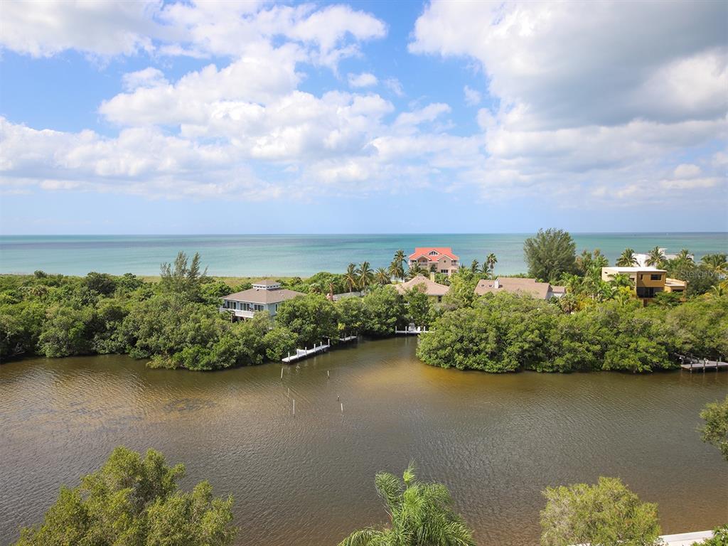 9397 Midnight Pass Road, Unit 501 Sarasota, FL 34242 - Photo 31 of 45 an aerial view of a houses with ocean view