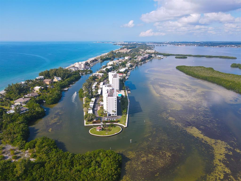 9397 Midnight Pass Road, Unit 501 Sarasota, FL 34242 - Photo 39 of 45 an aerial view of a house with yard swimming pool and outdoor seating