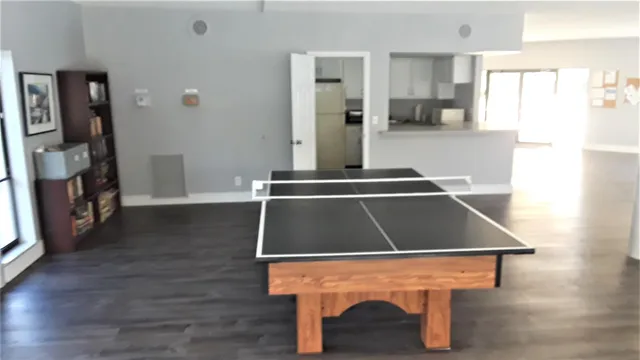 a view of a patio with a table and chairs