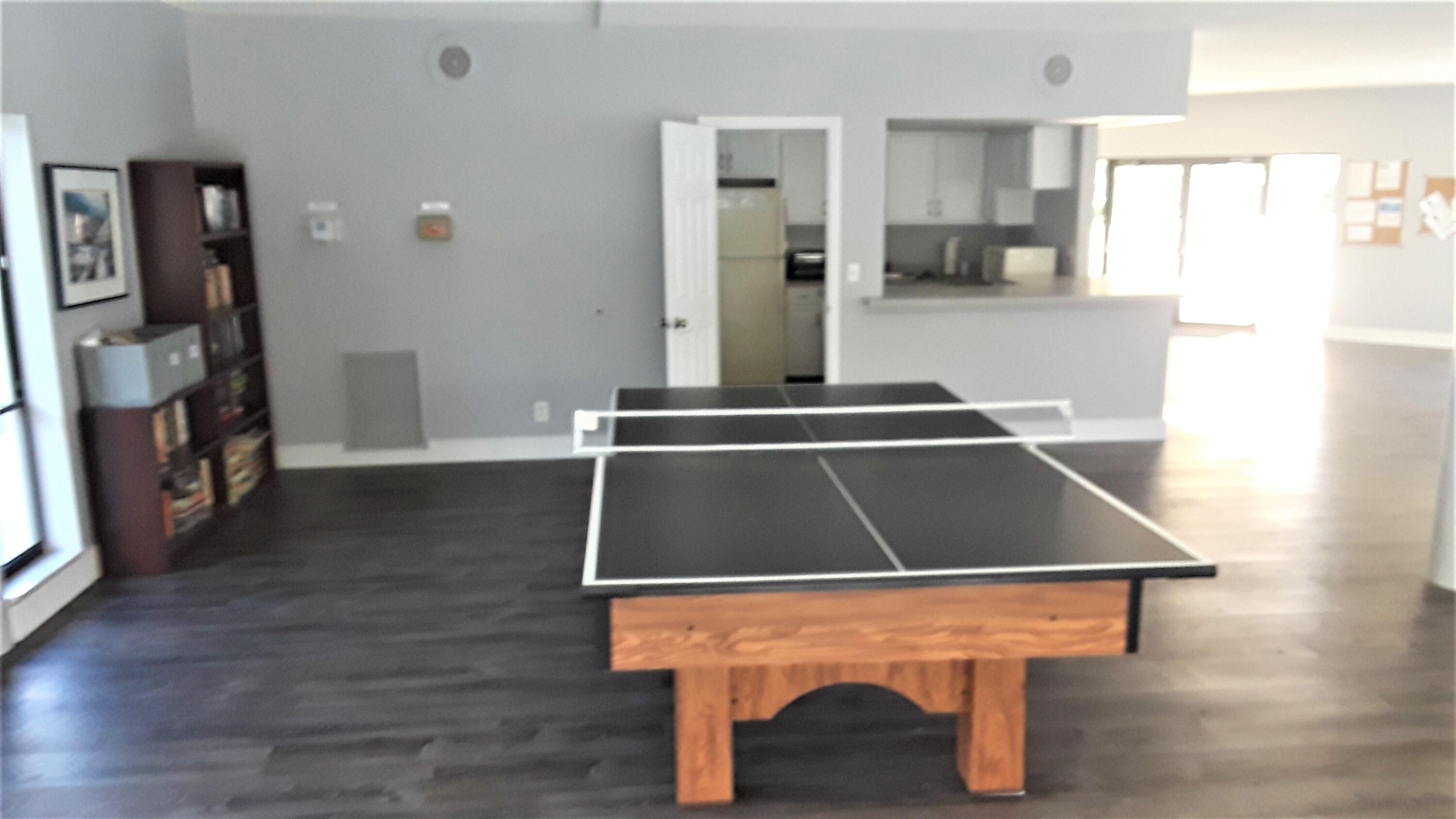 171 Deer Creek Boulevard, Unit 701 Deerfield Beach, FL 33442 - Photo 22 of 23 a room with table chairs and window