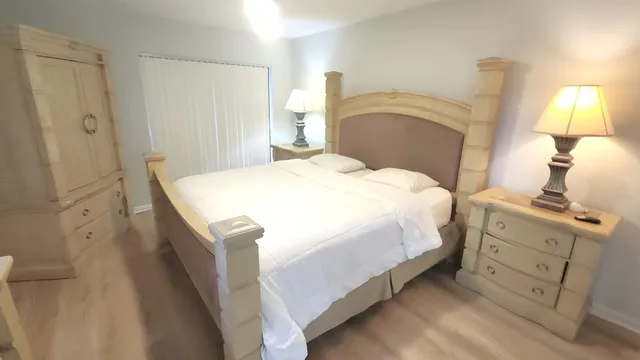 a bedroom with a bed and a cabinets