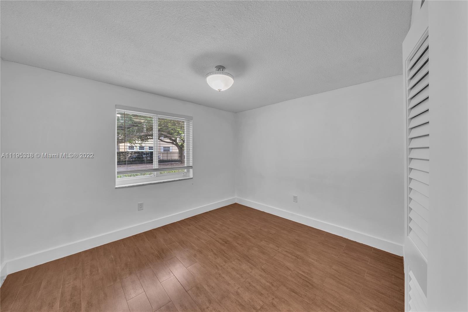 247 Bird Road Coral Gables, FL 33134 - Photo 17 of 22 an empty room with a workspace