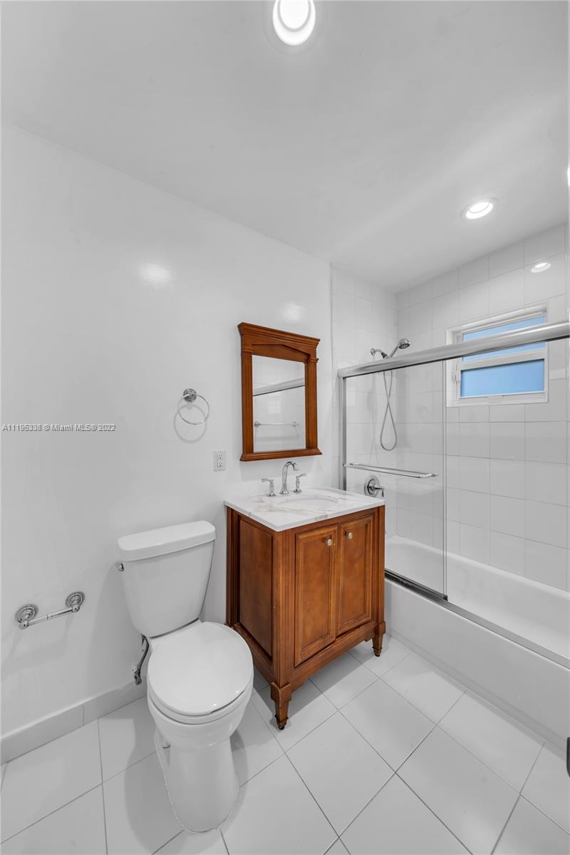 247 Bird Road Coral Gables, FL 33134 - Photo 20 of 22 a bathroom with a sink a toilet and shower