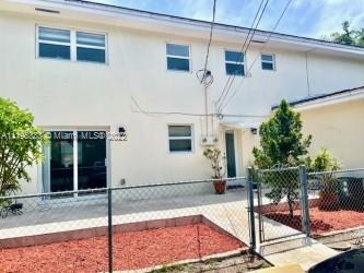 247 Bird Road Coral Gables, FL 33134 - Photo 2 of 22 a view of a house with backyard and porch
