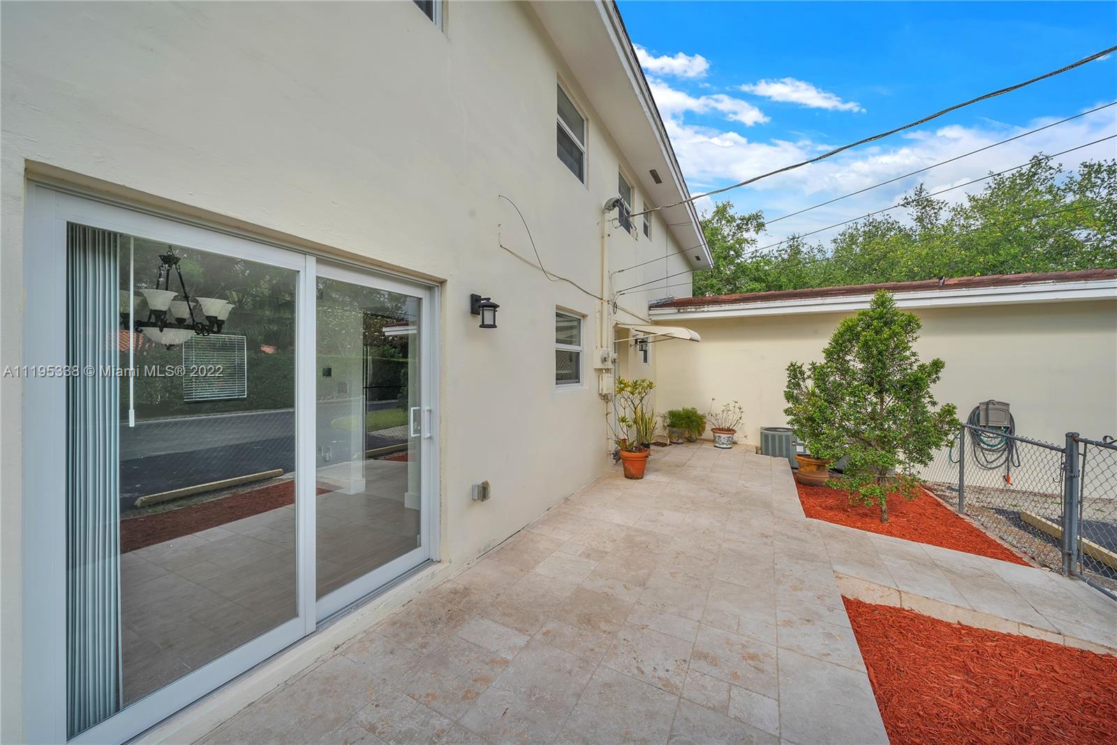 247 Bird Road Coral Gables, FL 33134 - Photo 21 of 22 a view of a house with backyard and sitting area