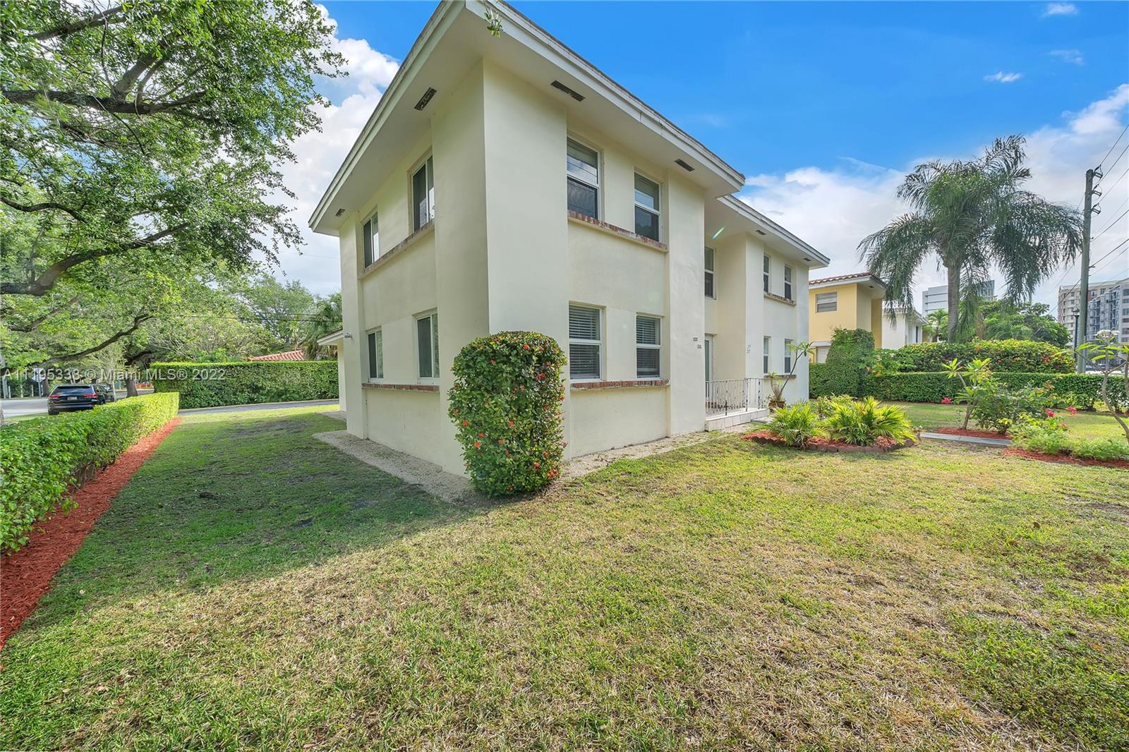 247 Bird Road Coral Gables, FL 33134 - Photo 3 of 22 a view of a house with backyard and garden