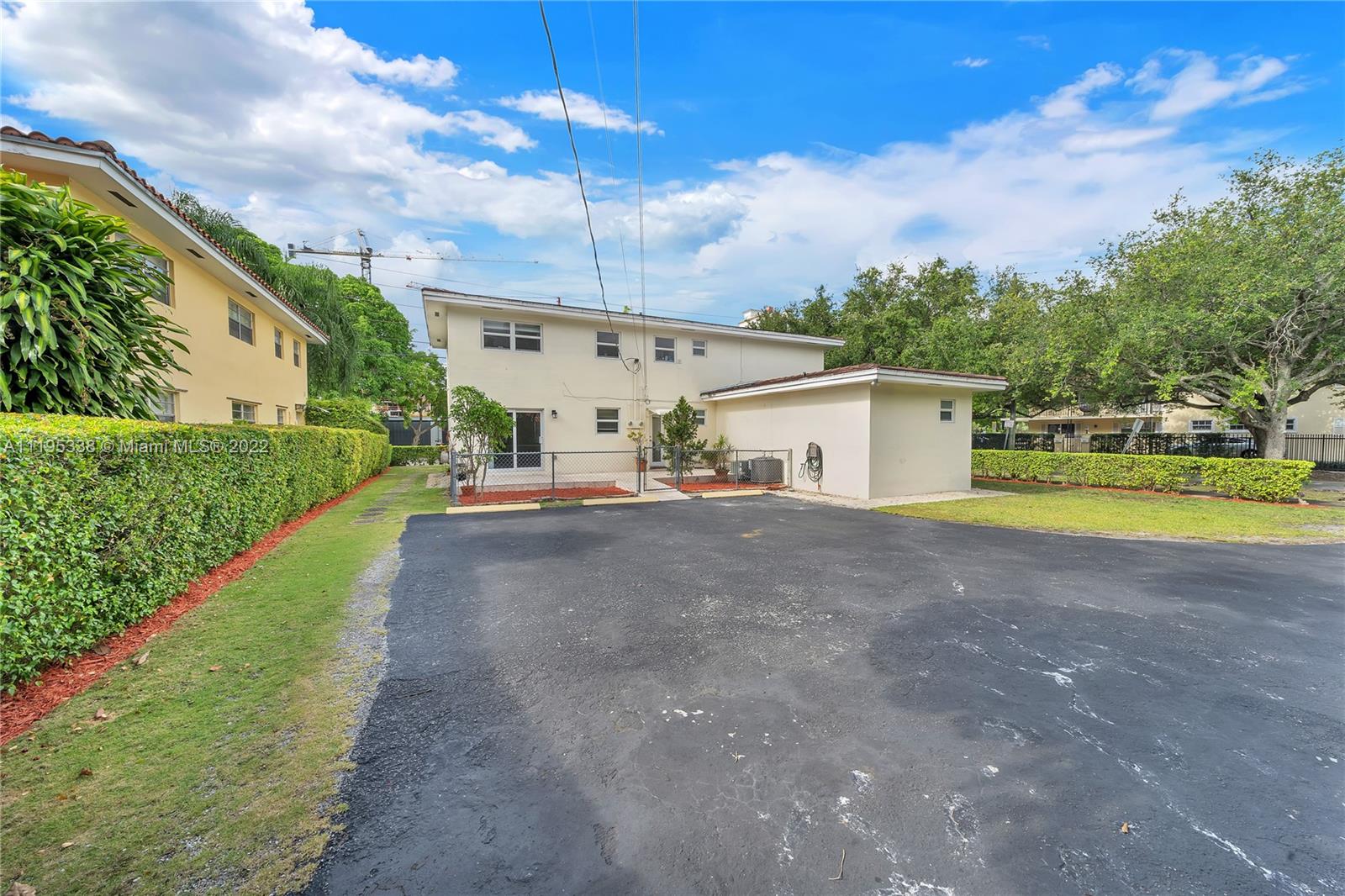 247 Bird Road Coral Gables, FL 33134 - Photo 7 of 22 a view of a house with a yard and sitting area