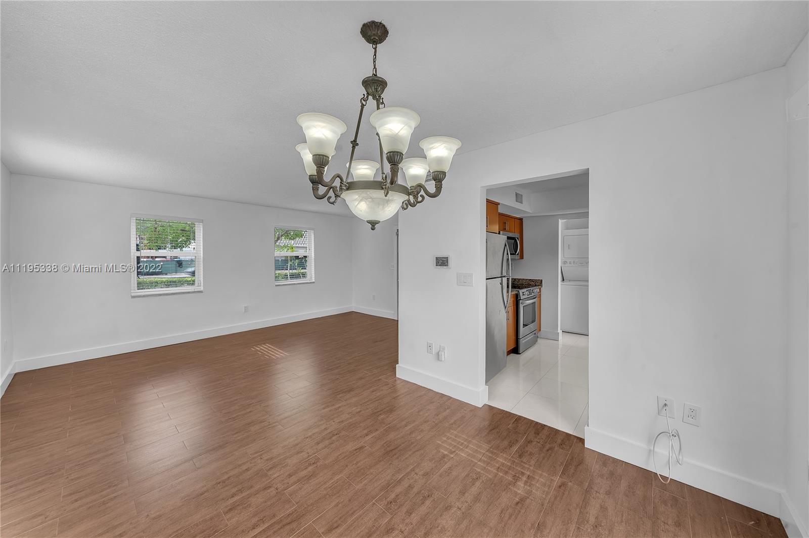 247 Bird Road Coral Gables, FL 33134 - Photo 10 of 22 a view of a livingroom with wooden floor