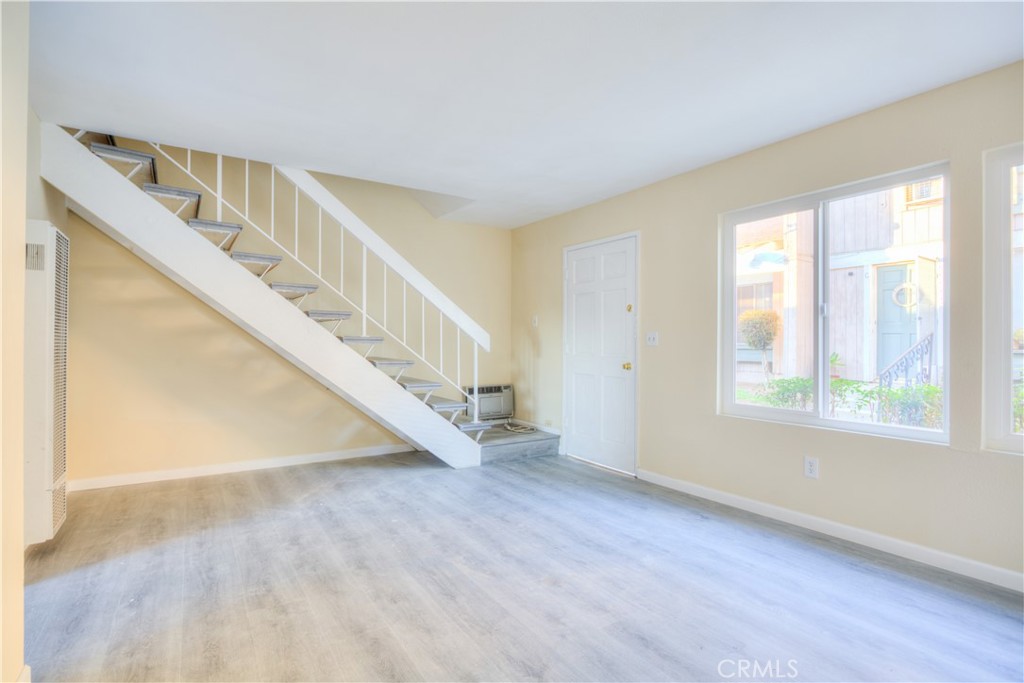 154 South Linda Way, Unit C Upland, CA 91786 - Photo 4 of 21 a view of entryway and hall with wooden floor