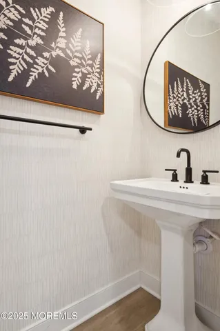 a bathroom with a sink and mirror
