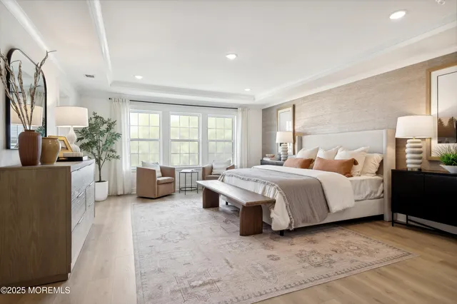 a spacious bedroom with a large bed and a large window